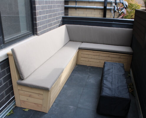rooftop balcony with built-in furniture seating fire pit wicker park chicago