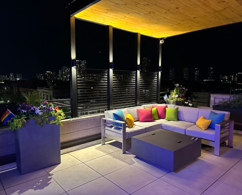 Roof deck with couch and fire table lakeview chicago