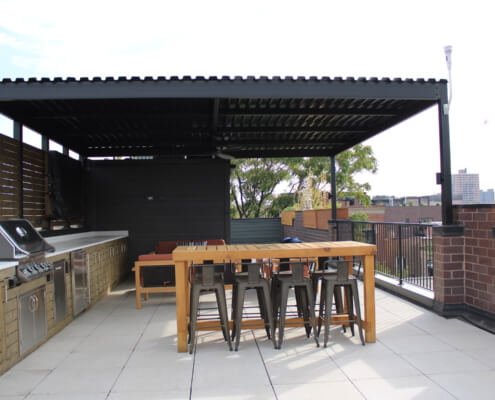 Rooftop deck with veranda and outdoor kitchen east lakeview chicago il