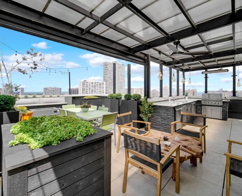 Covered rooftop kitchen with planters