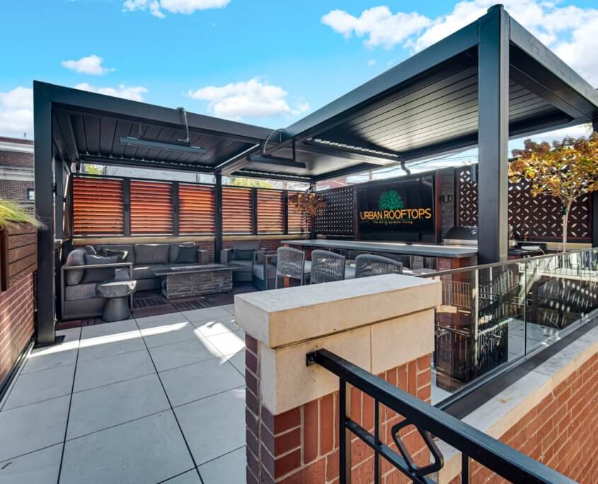 Pergola-covered garage rooftop with kitchen and lounge